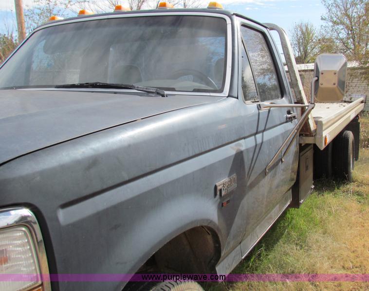image for item B1659 1994 Ford Super Duty XLT roll back truck