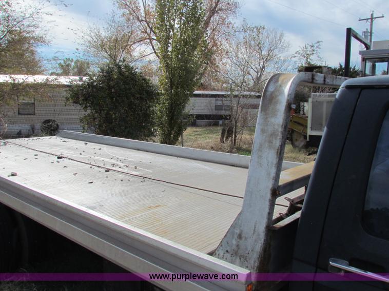 image for item B1659 1994 Ford Super Duty XLT roll back truck