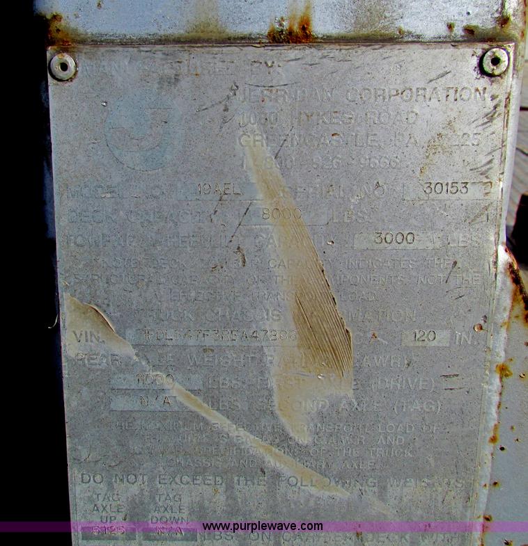 image for item B1659 1994 Ford Super Duty XLT roll back truck