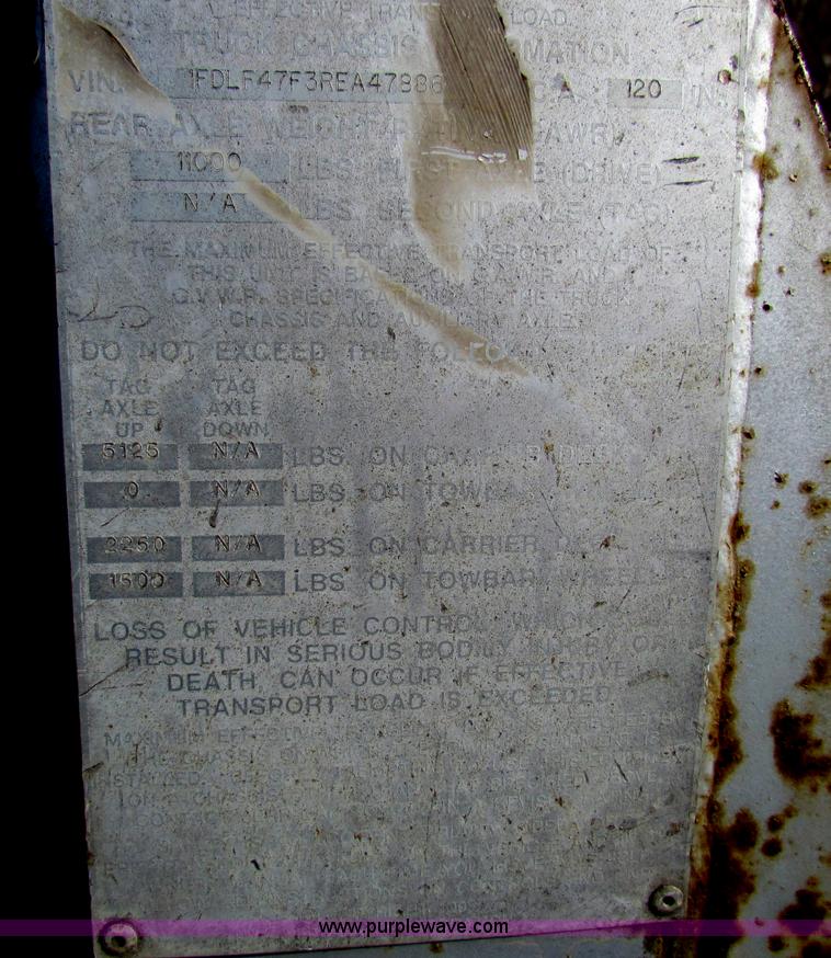 image for item B1659 1994 Ford Super Duty XLT roll back truck