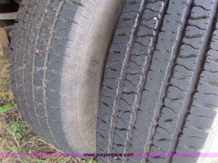 image for item B1659 1994 Ford Super Duty XLT roll back truck