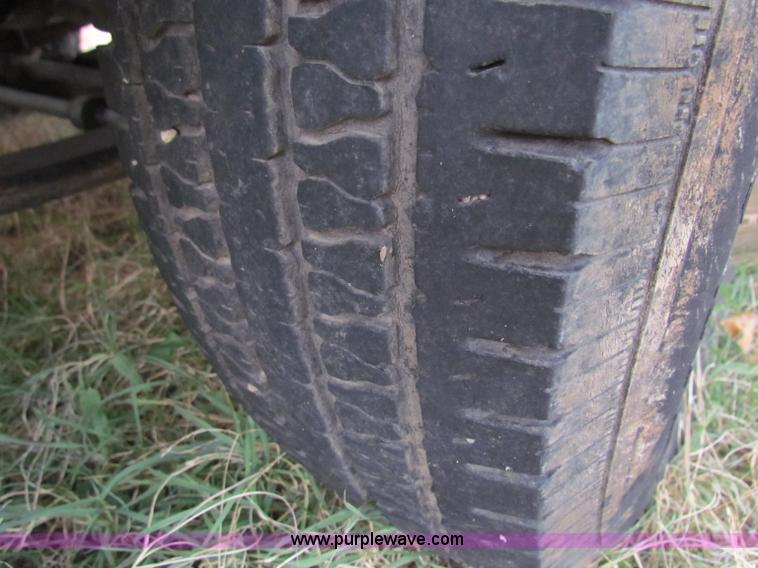 image for item B1659 1994 Ford Super Duty XLT roll back truck