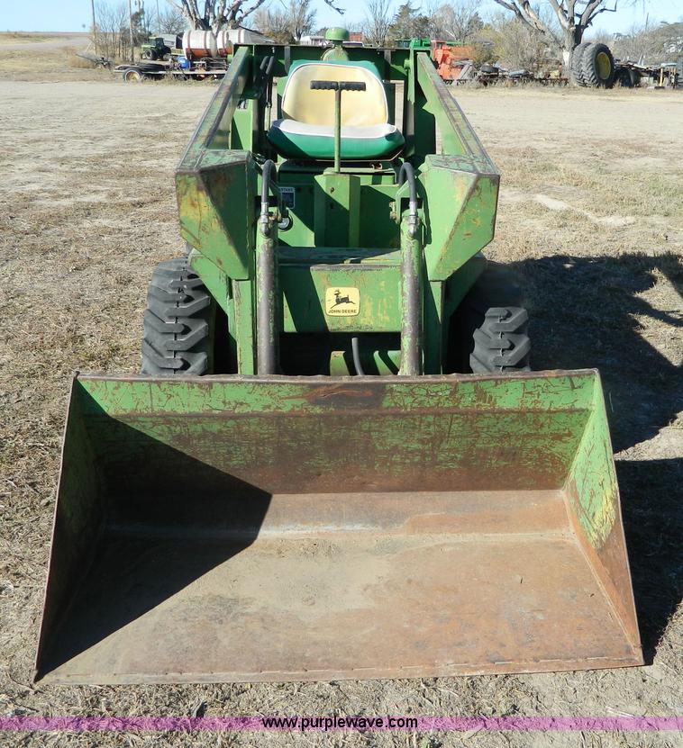 image for item G7619 John Deere 70 skid steer