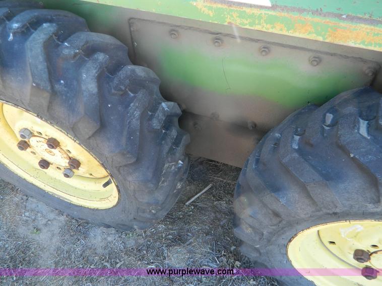 image for item G7619 John Deere 70 skid steer