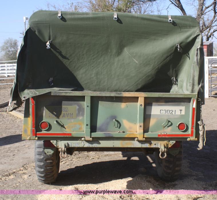image for item F2515 Army trailer with racks and tarp