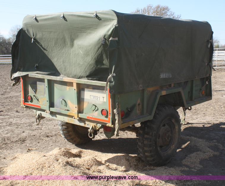 image for item F2515 Army trailer with racks and tarp