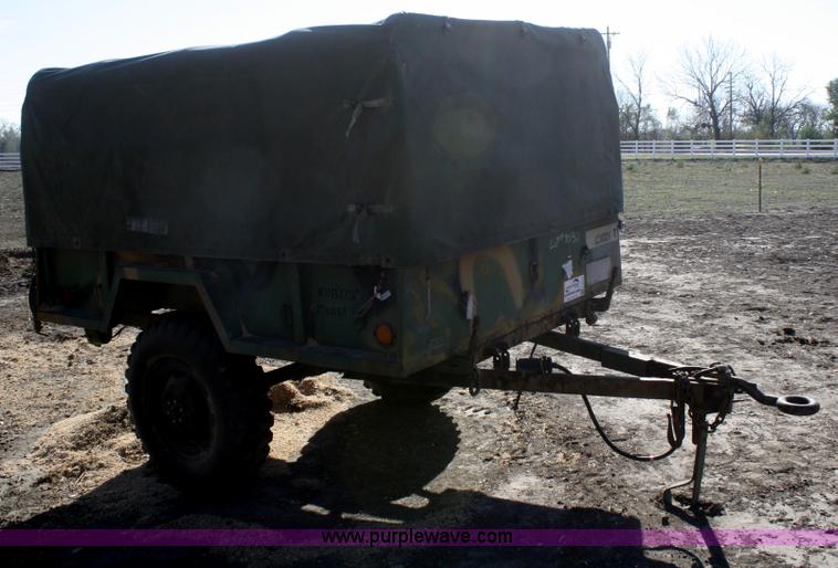 image for item F2515 Army trailer with racks and tarp