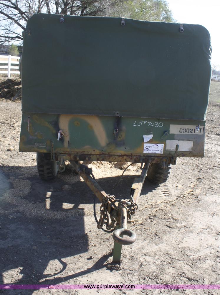 image for item F2515 Army trailer with racks and tarp