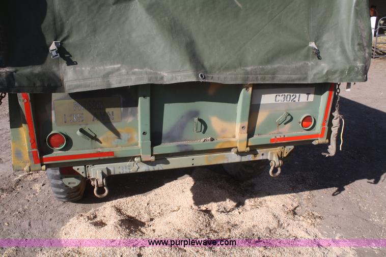 image for item F2515 Army trailer with racks and tarp