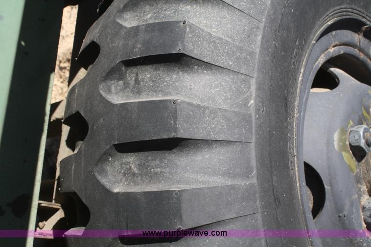 image for item F2515 Army trailer with racks and tarp