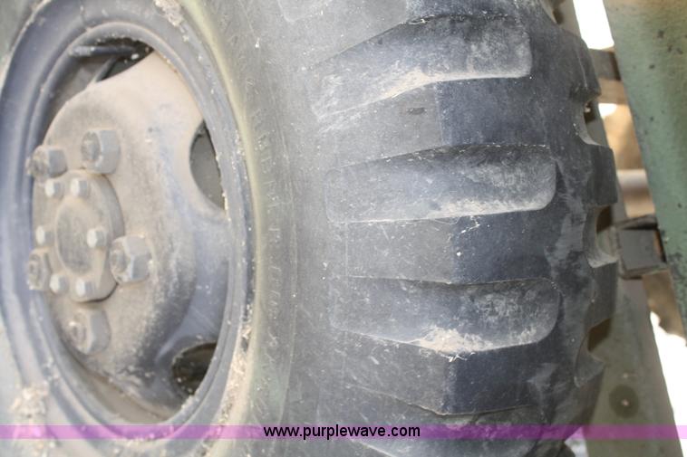 image for item F2515 Army trailer with racks and tarp