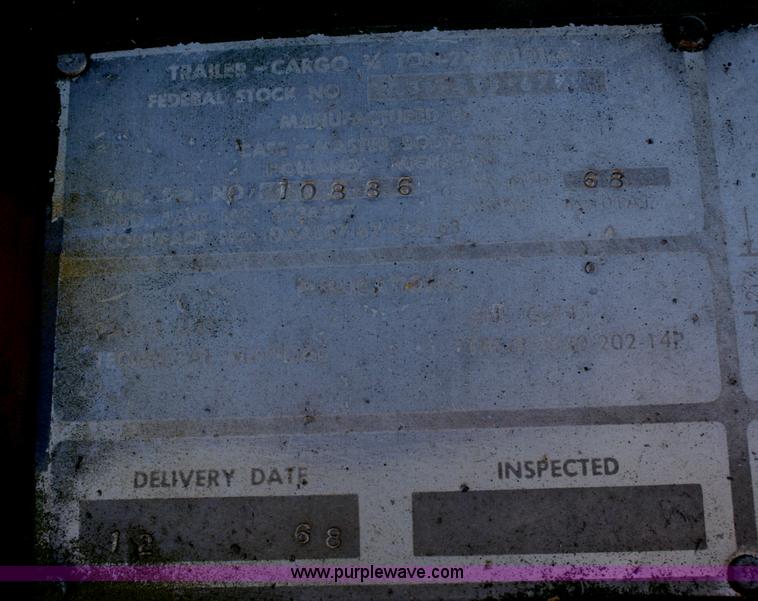 image for item F2515 Army trailer with racks and tarp