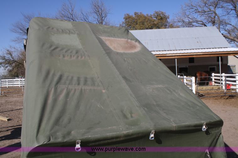 image for item F2515 Army trailer with racks and tarp