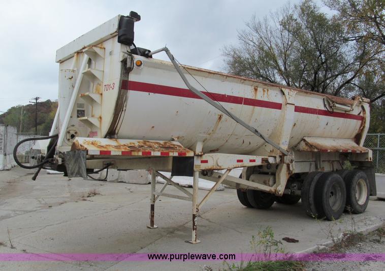 image for item E5632 2001 Ramco 24' barrel end dump trailer