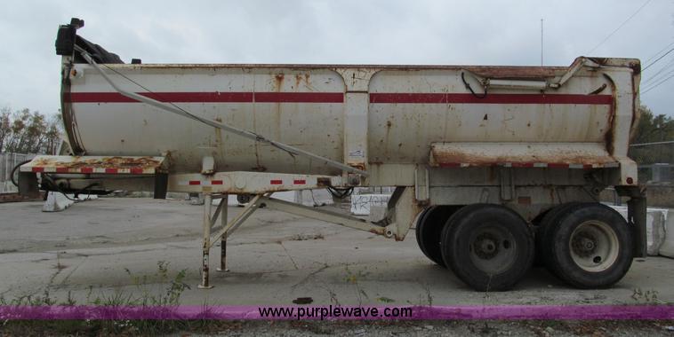 image for item E5632 2001 Ramco 24' barrel end dump trailer