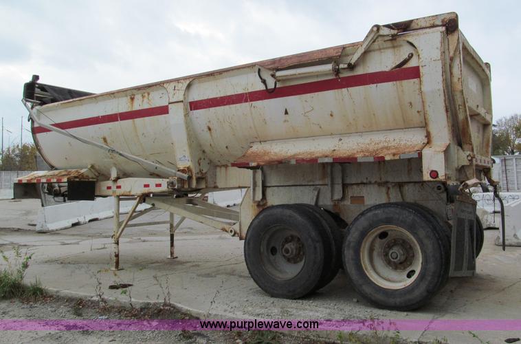 image for item E5632 2001 Ramco 24' barrel end dump trailer