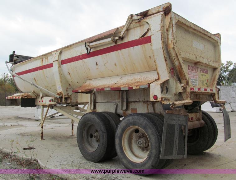 image for item E5632 2001 Ramco 24' barrel end dump trailer