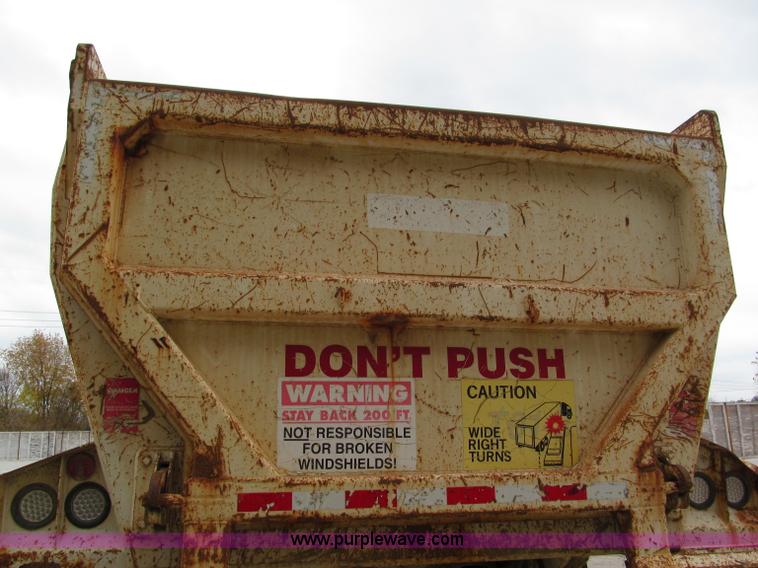 image for item E5632 2001 Ramco 24' barrel end dump trailer