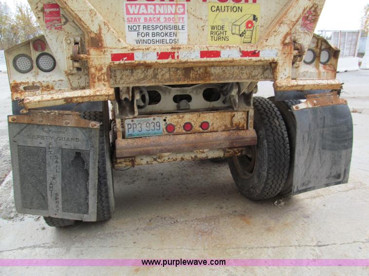 image for item E5632 2001 Ramco 24' barrel end dump trailer