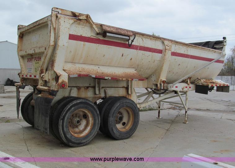 image for item E5632 2001 Ramco 24' barrel end dump trailer