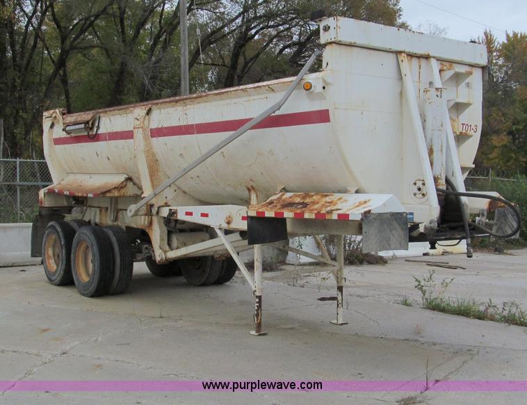image for item E5632 2001 Ramco 24' barrel end dump trailer