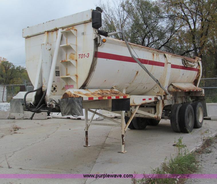 image for item E5632 2001 Ramco 24' barrel end dump trailer