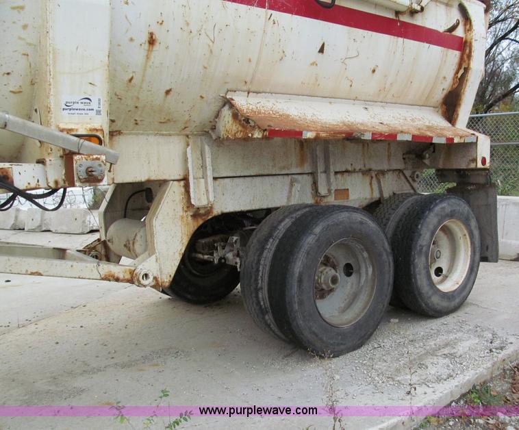 image for item E5632 2001 Ramco 24' barrel end dump trailer