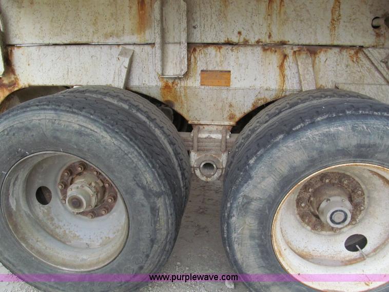 image for item E5632 2001 Ramco 24' barrel end dump trailer