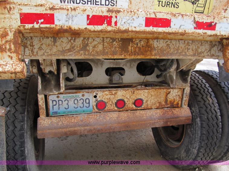 image for item E5632 2001 Ramco 24' barrel end dump trailer