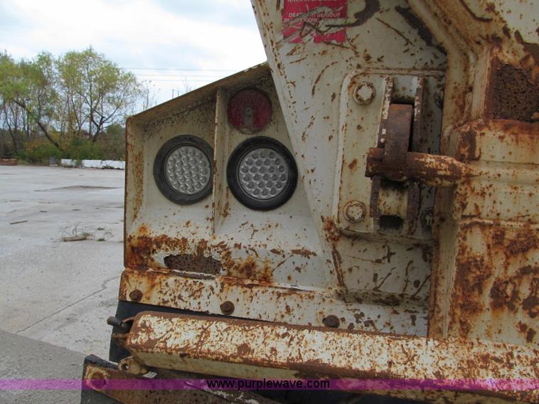 image for item E5632 2001 Ramco 24' barrel end dump trailer