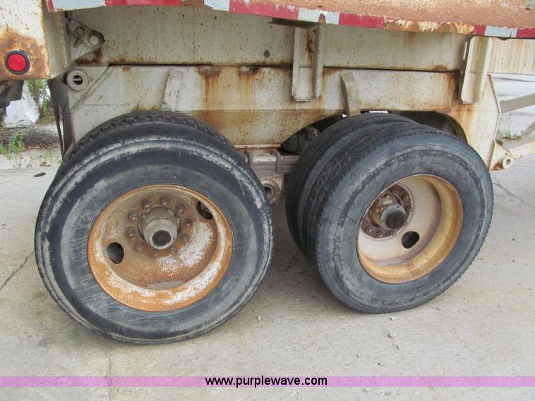 image for item E5632 2001 Ramco 24' barrel end dump trailer