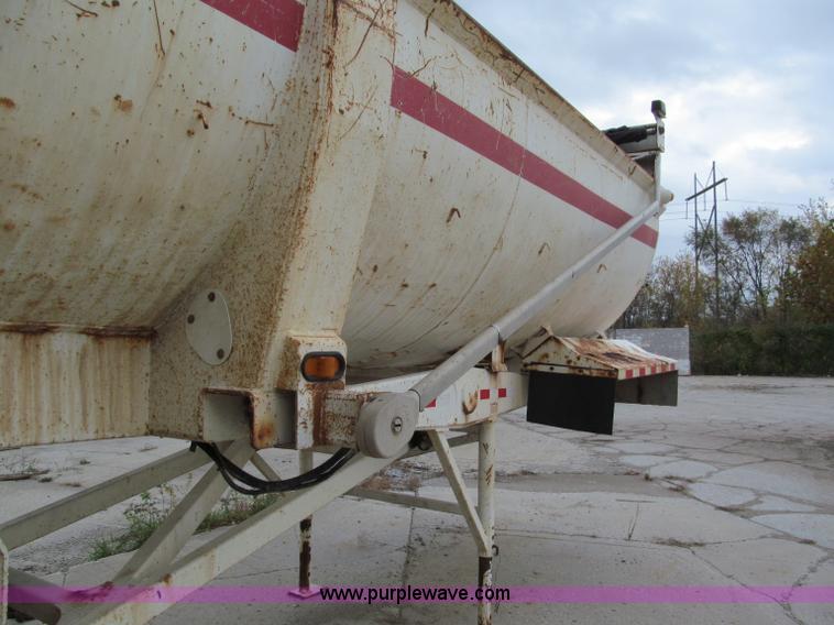 image for item E5632 2001 Ramco 24' barrel end dump trailer