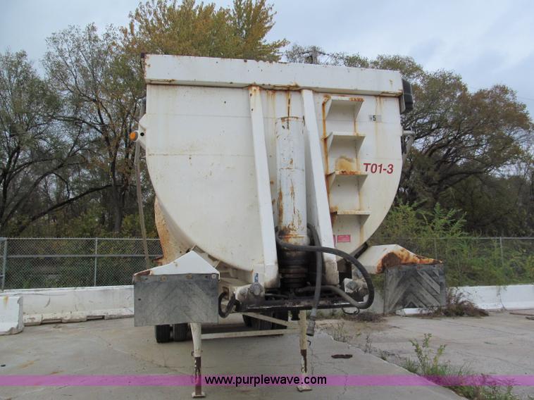 image for item E5632 2001 Ramco 24' barrel end dump trailer