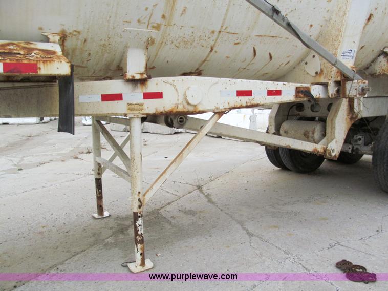 image for item E5632 2001 Ramco 24' barrel end dump trailer