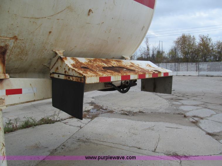 image for item E5632 2001 Ramco 24' barrel end dump trailer