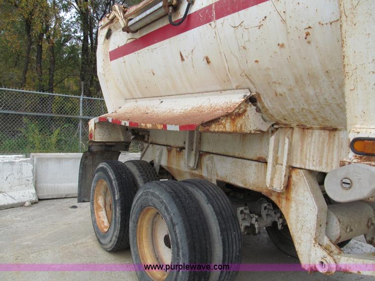 image for item E5632 2001 Ramco 24' barrel end dump trailer