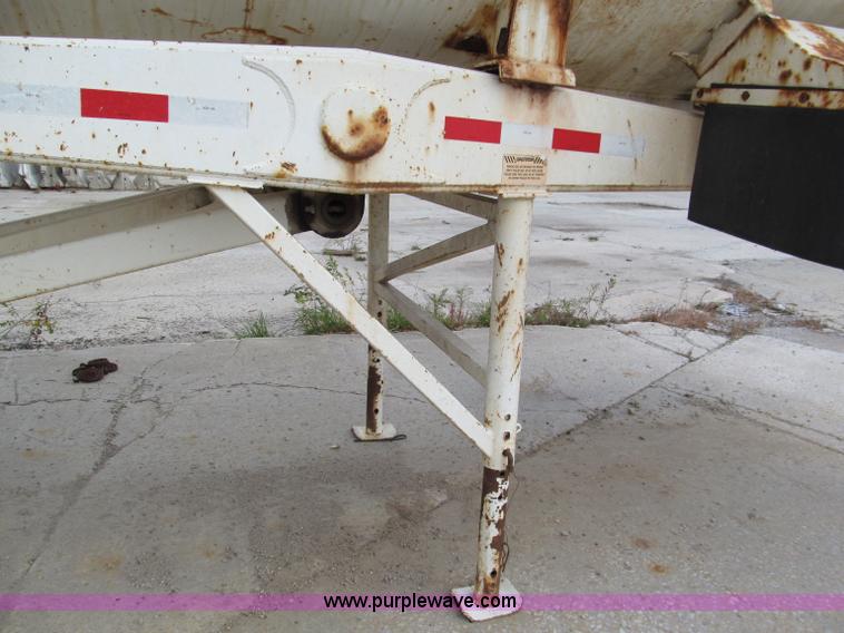 image for item E5632 2001 Ramco 24' barrel end dump trailer