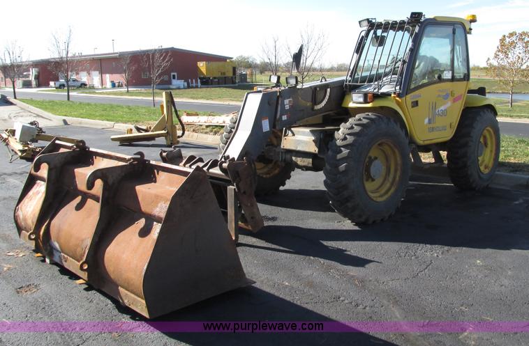 image for item F4015 2002 New Holland LM430 ATPTMC telehandler