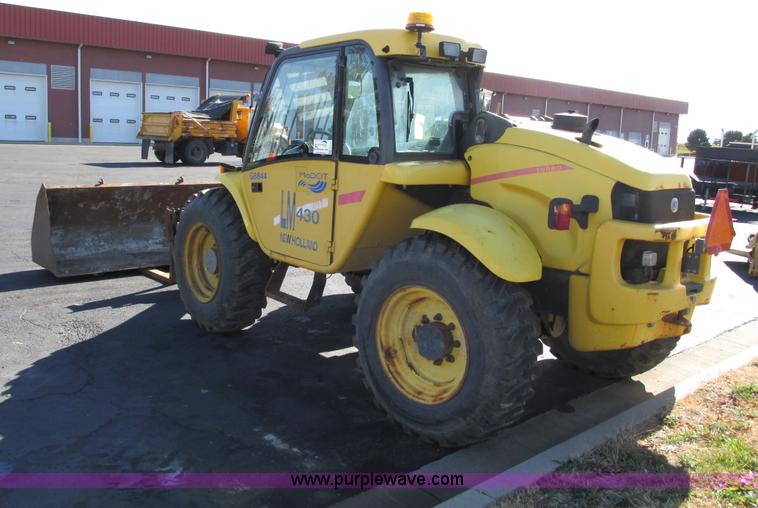 image for item F4015 2002 New Holland LM430 ATPTMC telehandler