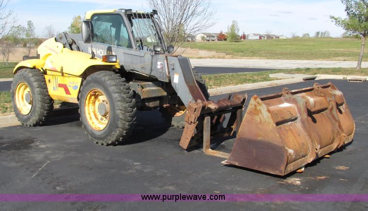 image for item F4015 2002 New Holland LM430 ATPTMC telehandler