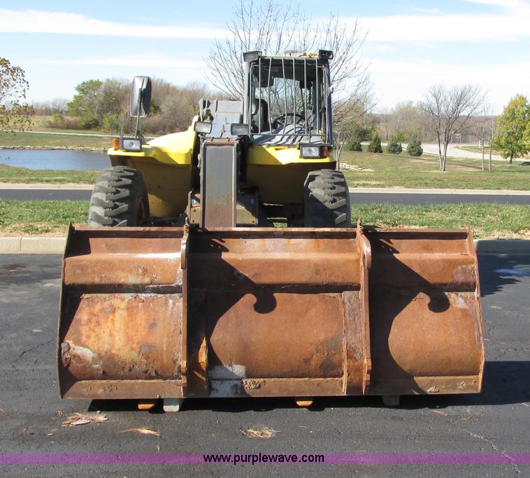 image for item F4015 2002 New Holland LM430 ATPTMC telehandler