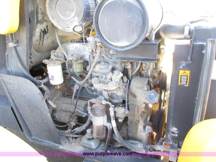 image for item F4015 2002 New Holland LM430 ATPTMC telehandler