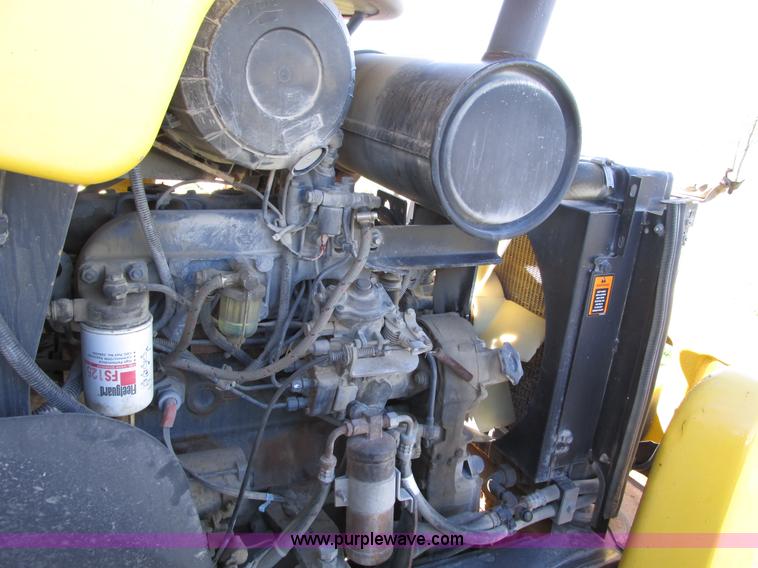 image for item F4015 2002 New Holland LM430 ATPTMC telehandler