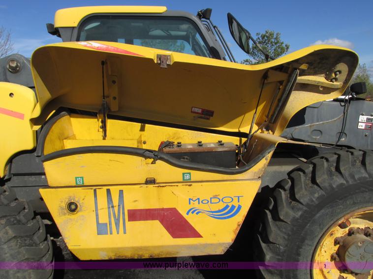 image for item F4015 2002 New Holland LM430 ATPTMC telehandler