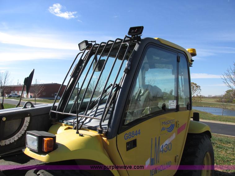 image for item F4015 2002 New Holland LM430 ATPTMC telehandler