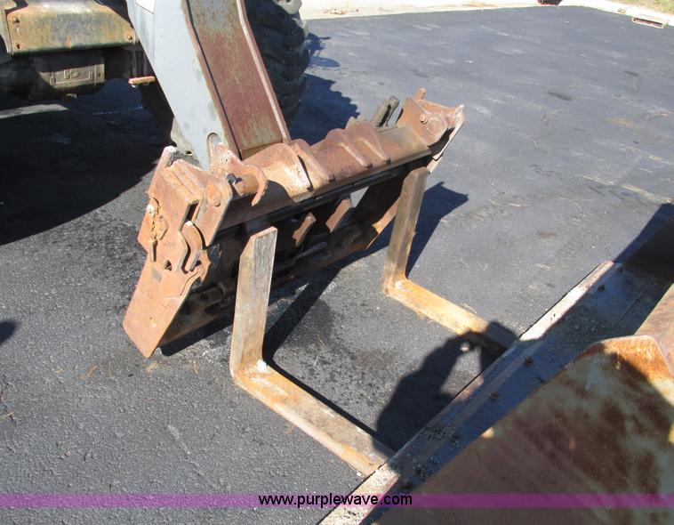 image for item F4015 2002 New Holland LM430 ATPTMC telehandler