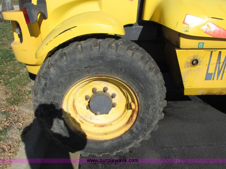 image for item F4015 2002 New Holland LM430 ATPTMC telehandler
