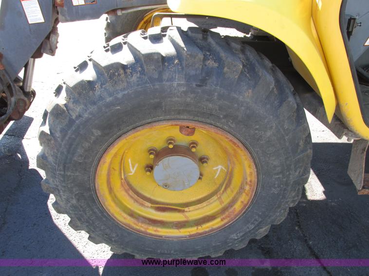 image for item F4015 2002 New Holland LM430 ATPTMC telehandler