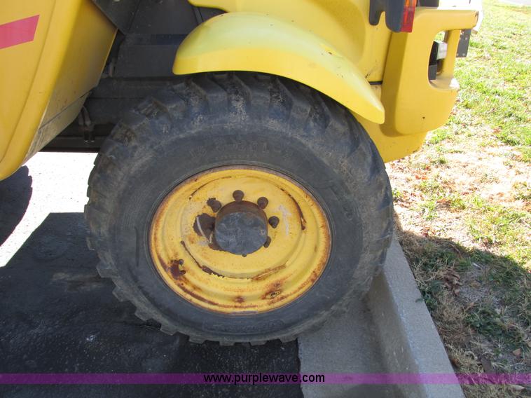 image for item F4015 2002 New Holland LM430 ATPTMC telehandler