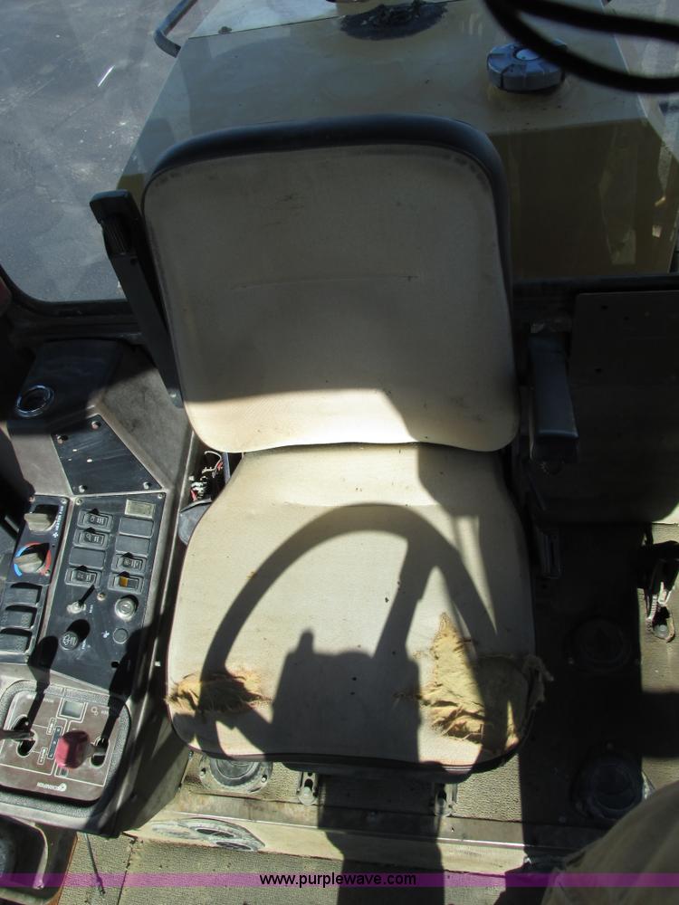 image for item F4016 1994 Champion 720A Series III articulated motor grader